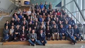 All SBS employees sitting on steps at DSU.